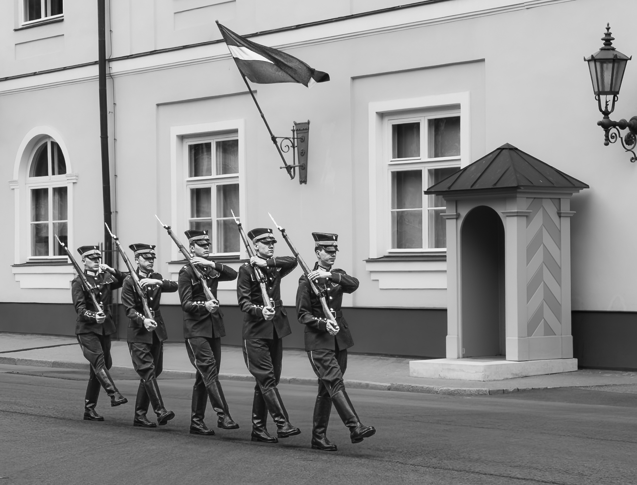 Changing the guard in Riga by Adrian Binney